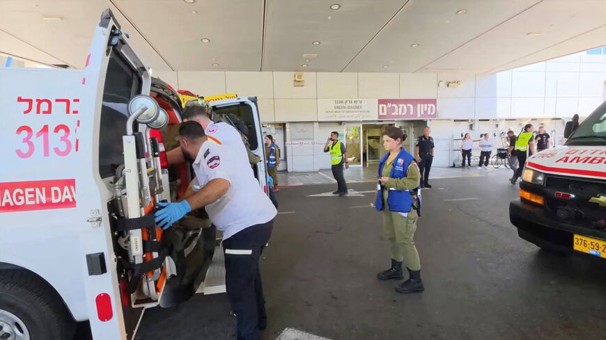 Paramedics work to move an Israeli casualty from inside an ambulance, after being wounded in an explosion in Lebanon, at Rambam Health Care Campus in Haifa, Israel, August 5, 2026. Rambam Health Care Campus/Handout via REUTERS