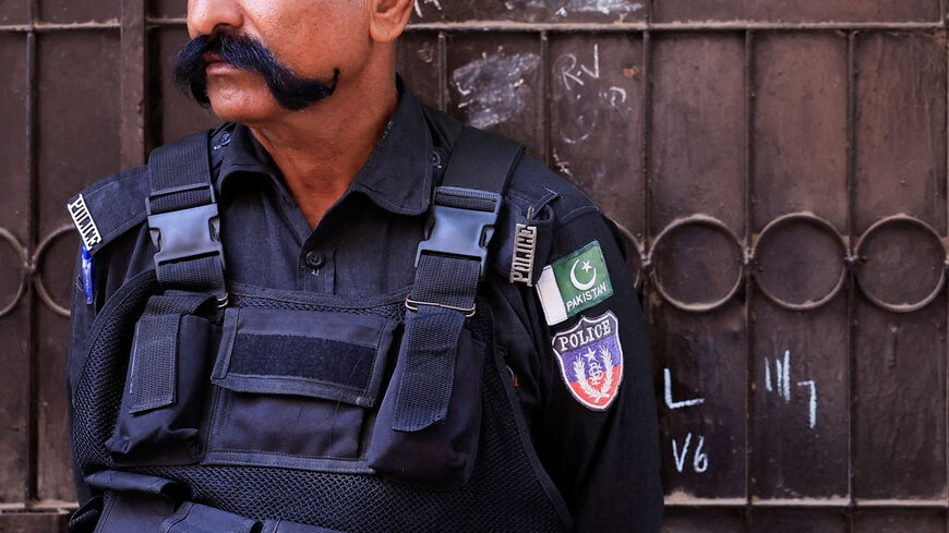 A police officer stands guard outside the home of a Christian family, following allegations of blasphemy and alleged desecration of the Koran, in Karachi, Pakistan, July 17, 2026. REUTERS/Akhtar Soomro