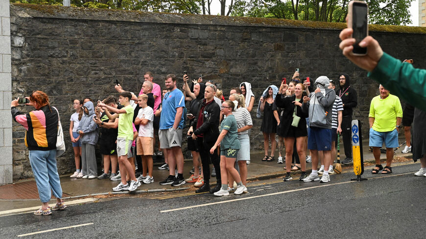 People gather outside the Special Criminal Court where alleged Irish crime gang boss Daniel Kinahan is due to appear on charges of organised criminal activity after being extradited to Ireland from the United Arab Emirates (UAE), in Dublin, Ireland, August 9, 2026. REUTERS/Natalia Campos