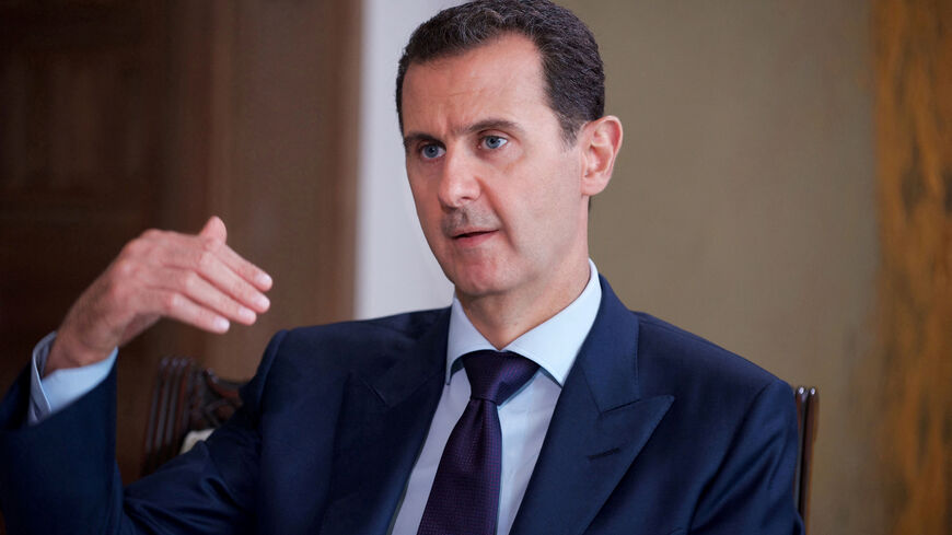 FILE PHOTO: Syria's President Bashar al-Assad speaks during an interview with Australia's SBS News channel in this handout picture provided by SANA on July 1, 2016. SANA/Handout via REUTERS/File Photo
