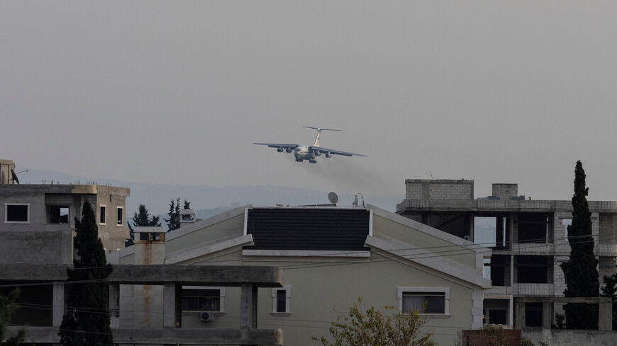 FILE PHOTO: A Russian military aircraft approaches the Hmeimim air base in Syria's coastal Latakia, Syria, December 15, 2024. REUTERS/Umit Bektas/File Photo