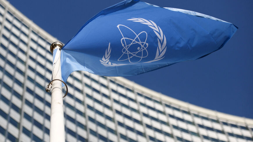 A flag with the logo of the International Atomic Energy Agency (IAEA) waves in front of the IAEA headquarters in Vienna, Austria, March 1, 2021. REUTERS/Lisi Niesner