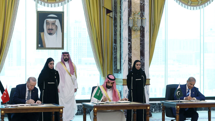 Turkish President Tayyip Erdogan, Saudi Crown Prince Mohammed bin Salman and Pakistan's Prime Minister Shehbaz Sharif sign a joint defense agreement in Mecca, Saudi Arabia, August 7, 2026. Murat Cetinmuhurdar/Turkish Presidential Press Office/Handout via REUTERS