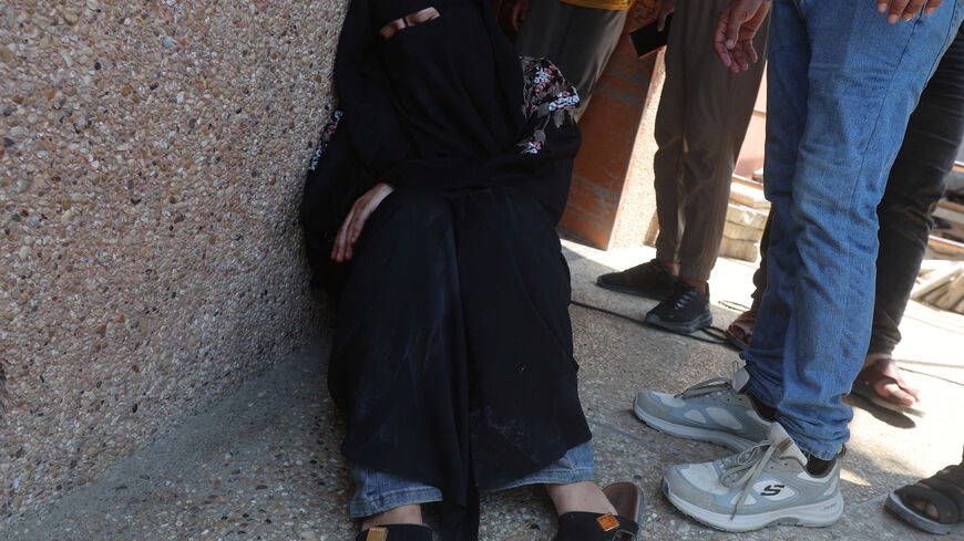 Mourners attend the funeral of a Palestinian man Huthaifa Kawari, who was killed in an Israeli strike, according to medics, at Nasser Hospital in Khan Younis, in the southern Gaza Strip, August 13, 2026. REUTERS/Ramadan Abed