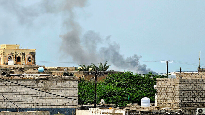 Smoke rises during Houthi missile and drone strikes on the Red Sea port city of Mocha, Yemen, August 9, 2026. Picture taken with a mobile phone. REUTERS/Stringer