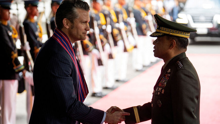 FILE PHOTO: U.S. Defense Secretary Pete Hegseth and Chief of Staff of the Armed Forces of the Philippines Romeo Brawner Jr shake hands at Camp Aguinaldo, in Quezon City, Metro Manila, Philippines, March 28, 2025. REUTERS/Lisa Marie David/File Photo