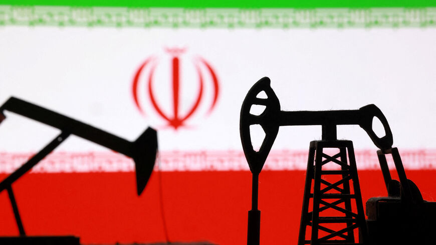 3D-printed oil pump jacks and an Iranian flag appear in this illustration taken March 2, 2026. REUTERS/Dado Ruvic/Illustration