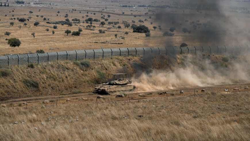 An Israeli tank drives along the ceasefire line between the Israeli-occupied Golan Heights and Syria, on its Israeli side August 20, 2026. REUTERS/Ayal Margolin