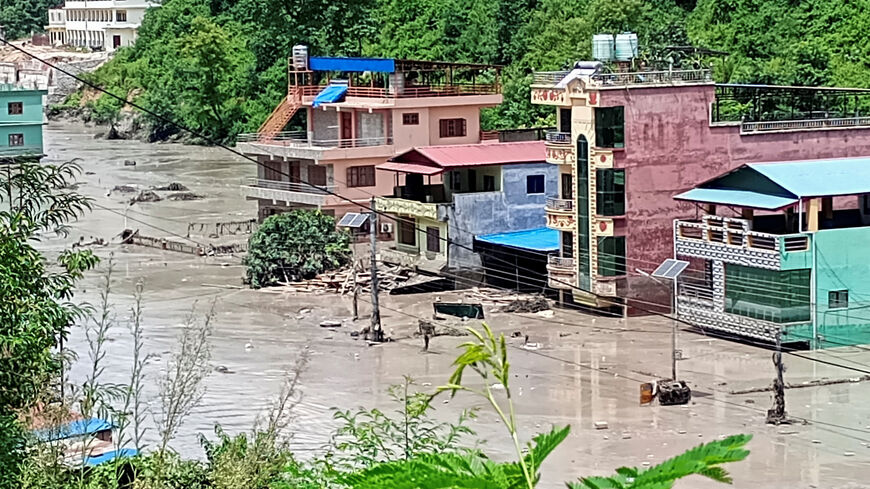 A flooded road following a flash flood in Galchhi in the Dhading district, Nepal, August 26, 2026. REUTERS/Stringer