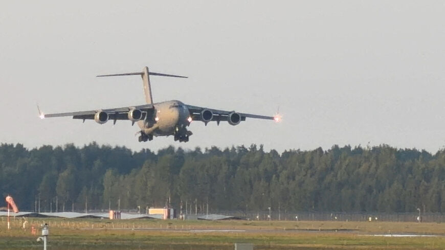 A C-17 Globemaster, believed to be carrying U.S. CIA Director John Ratcliffe, lands near Riga, Latvia, August 25, 2026, in this frame obtained from a social media video. @ALFREDSPODINS VIA X/via REUTERS