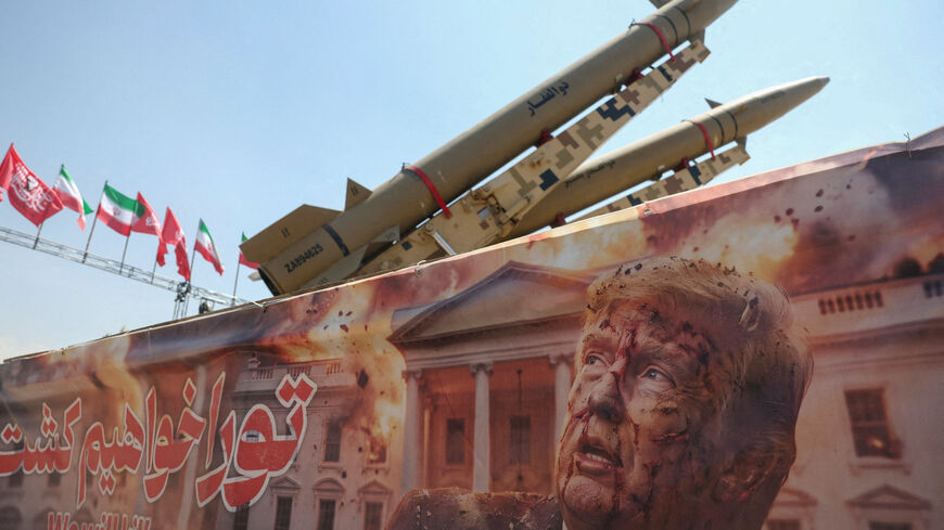 A banner with a picture of U.S. President Donald Trump next to an Iranian missile system at Azadi Square in Tehran, Iran, July 30, 2026. Majid Asgaripour/WANA (West Asia News Agency) via REUTERS