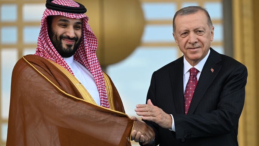 Turkish President Recep Tayyip Erdogan (R) welcomes Saudi Crown Prince Mohammed bin Salman (L) upon his arrival during an official ceremony at the Presidential Complex in Ankara on June 22, 2022.