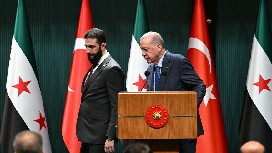 Turkish President Recep Tayyip Erdogan (R) and Syrian President Ahmed al-Sharaa arrive for a joint press conference following their meeting at the Presidential Palace in Ankara, Feb. 4, 2025.