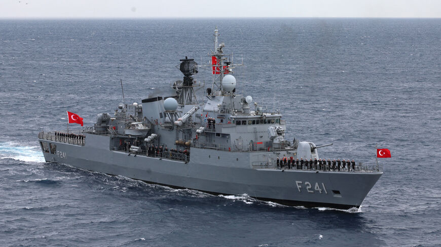 Servicemen of Yavuz class, TCG Turgutreis (F-241), warship stand at attention on the deck as they participate in the live-fire phase of the "Blue Homeland-2026" (Mavi Vatan) tactical military exercises in the eastern Mediterranean Sea, in Antalya on April 9, 2026.