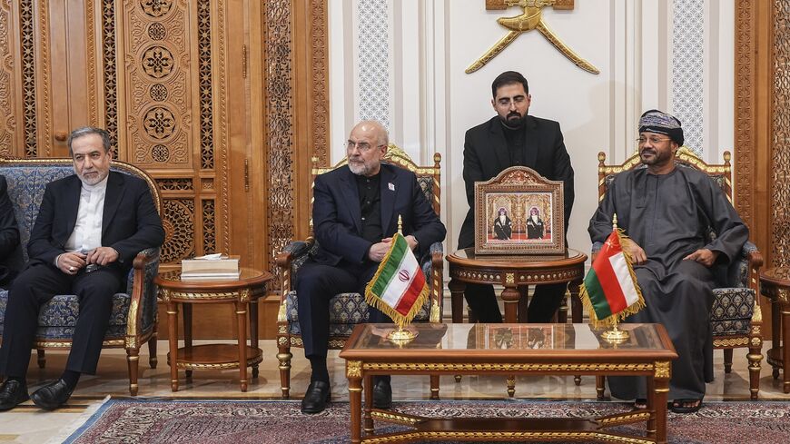 Iranian Foreign Minister Abbas Araghchi (L), Iranian parliament speaker Mohammad Bagher Ghalibaf (2nd L) and Omani Foreign Minister Badr bin Hamad Al Busaidi (R) attend a meeting in Muscat, Oman, on June 22, 2026.