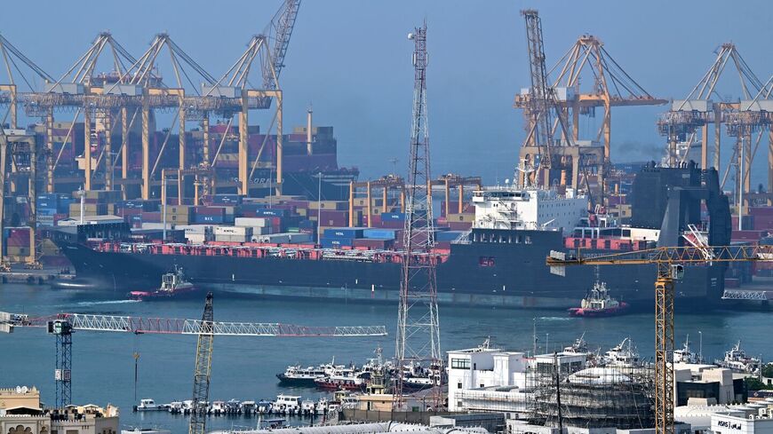 Ships are docked along a pier at the Khor Fakkan Container Terminal, the only natural deep-sea port in the region and one of the major container ports in Sharjah Emirate, along the Gulf of Oman, on July 14, 2026. — AFP via Getty Images