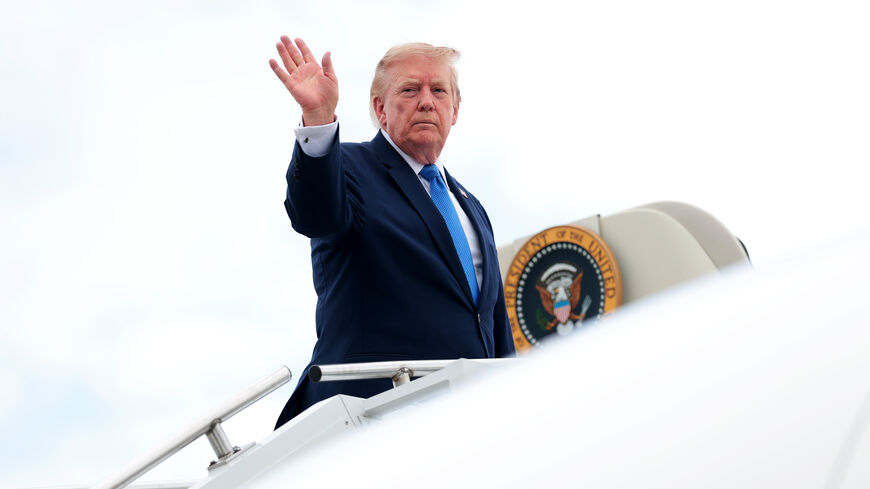 President Donald Trump waves as he boards Air Force One at Morristown Municipal Airport on Aug. 2, 2026 in Morristown, New Jersey. 