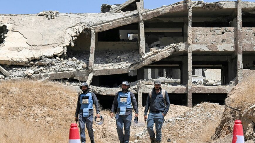 Members of the HALO Trust prepare to detonate unexploded war-remnants in the Jobar suburb northeast of Damascus