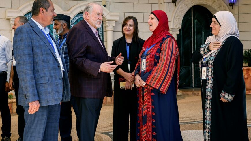 US Ambassador to Israel Mike Huckabee is greeted by members of the local municipality as he arrives to visit the home of a Palestinian-American in the Israeli-occupied West Bank town of Turmus Ayya