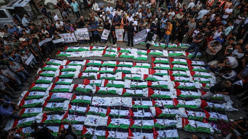 A mass burial for Palestinians, including 62 children, whose remains were recovered from rubble in Gaza City. Sept 2026.