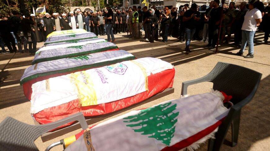 Hundreds gather in Kfar Rumman, Lebanon on Tuesday to mourn people killed in an Israeli airstrike a day prior