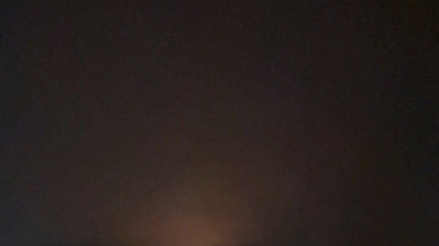 A flash of light rises from the ground after an apparent projectile streaks across the sky and appears to reach the ground over Jordan as seen from Eilat, Israel, September 1, 2026, in this screengrab obtained from a video. Video obtained by Reuters