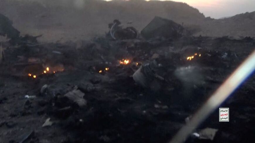 Burning debris from the wreckage of what the Houthi military media wing says is a downed Saudi jet, at a location given as Yemen