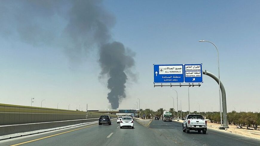 Large plume of black smoke rises from the fuel storage depot at King Khalid International Airport, in Riyadh