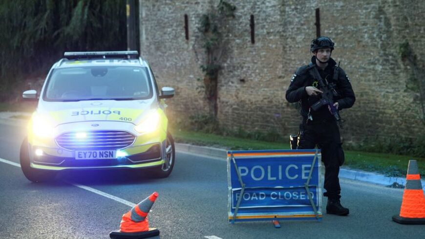 A police officer blocks a road near the RAF Fairford airbase, in Fairford