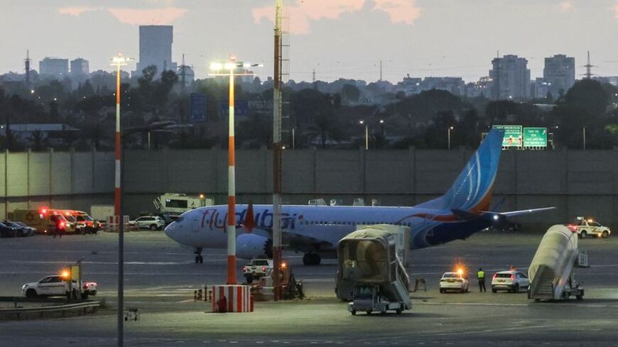 Passengers from a FlyDubai flight to Israel from United Arab Emirates that was diverted to Saudi Arabia after an emergency signal arrive at Ben Gurion International Airport