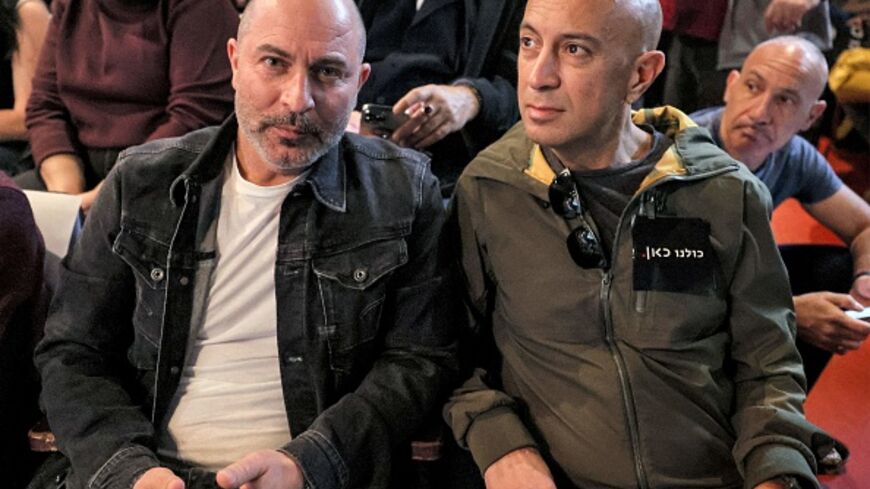  ISRAEL-ENTERTAINMENT-TELEVISION-POLITICS-GOVERNMENT-MASS-MEDIA-D (L to R) Lior Raz and Avi Issacharoff, co-creators of the hit Israeli TV show "Fauda", attend a demonstration against the Israeli government's plans to shut-down public broadcaster KAN, in Israel's Mediterranean coastal city of Tel Aviv on January 25, 2023. (Photo by JACK GUEZ / AFP) (Photo by JACK GUEZ/AFP via Getty Images)