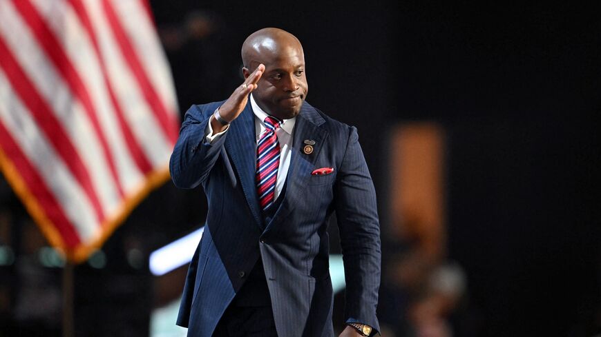 US Republican Representative Wesley Hunt of Texas gestures after speaking during the first day of the 2024 Republican National Convention at the Fiserv Forum in Milwaukee, Wisconsin, on July 15, 2024. 