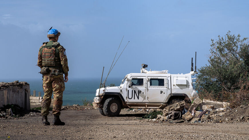 UN peacekeepers stand next to an armored vehicle during a patrol in southern Lebanon, Feb. 22, 2026.