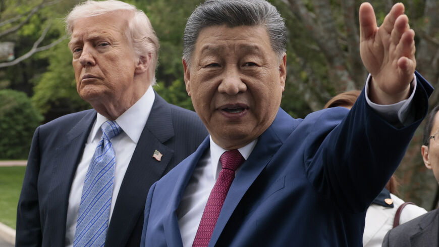 BEIJING, CHINA - MAY 15: U.S. President Donald Trump and Chinese President Xi Jinping tour Zhongnanhai Garden on May 15, 2026 in Beijing, China. Trump and other U.S. officials are finishing up a visit intended to address the Iran conflict, trade imbalances, and the Taiwan situation while establishing new bilateral boards for economic and AI oversight. (Photo by Evan Vucci-Pool/Getty Images)