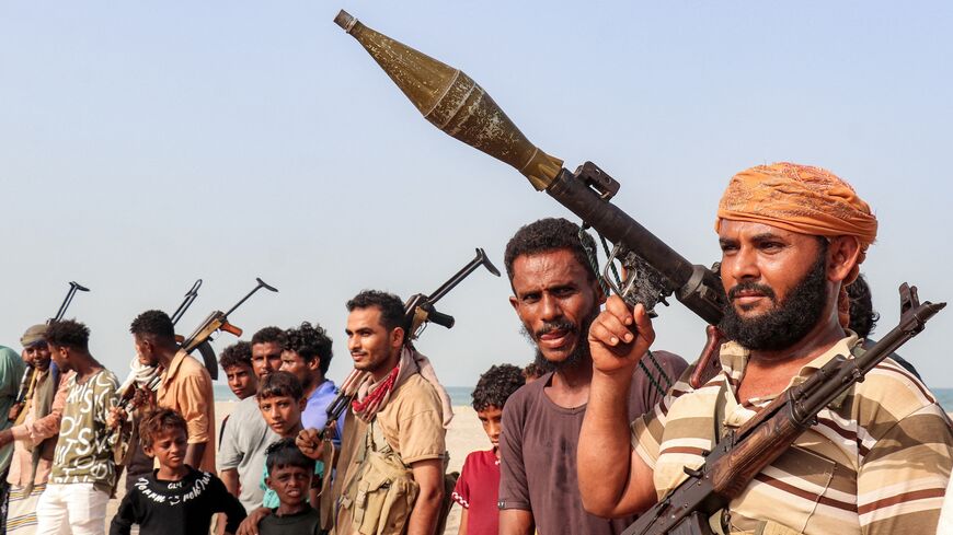 Fighters supporting the Aden-based, internationally recognized Yemeni government gather during a vigil along the Red Sea shore in Khokha, in Yemen's western Hodeidah province, on July 20, 2026. 