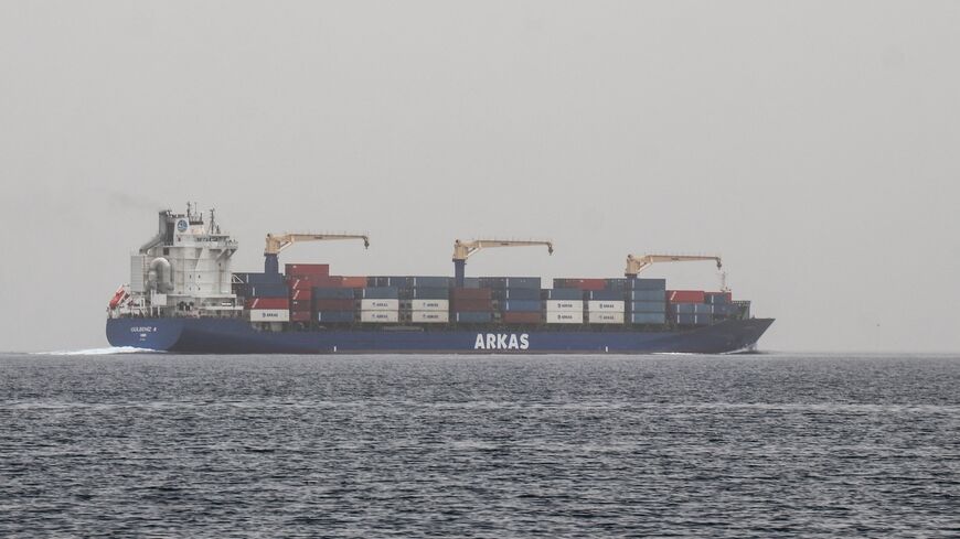 A commercial vessel passes through an international shipping lane off Yemen's Hanish Island in the Red Sea on July 27, 2026. 