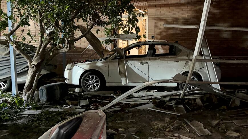 In this picture obtained by AFP from the Iranian news agency Tasnim on September 2, 2026 a destroyed vehicle is pictured at the site of an overnight strike in Kuhestak, Sirik County, in Iran's southern Hormozgan province on September 2, 2026. Iranian forces said on September 2 that they launched attacks on US military targets in the United Arab Emirates, Kuwait, Bahrain and other countries in the region, vowing "severe" consequences for renewed American attacks on the Islamic republic. (Photo by Masoud Moha