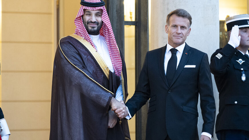France s President Emmanuel Macron welcomes Saudi Arabia s Crown Prince Mohammed bin Salman as he arrives for a State diner in his honor at the Elysee Palace in Paris on Aug. 24, 2026.
