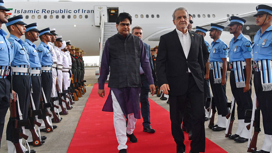 Iran's President Masoud Pezeshkian disembarks from his plane