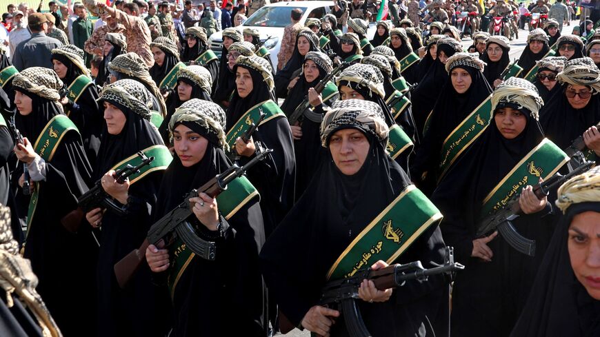 Members of Iran's Basij paramilitary force march 