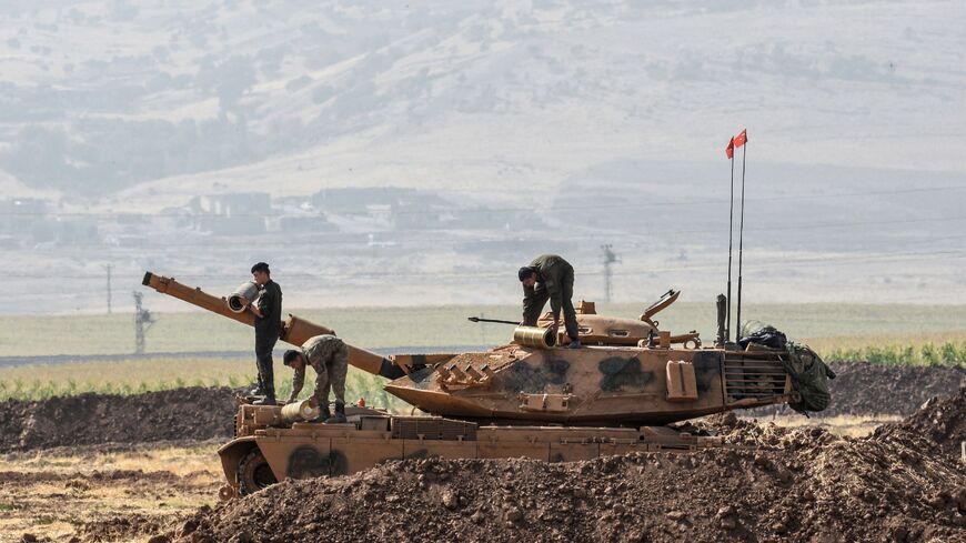 Turkish soldiers conduct military exercises near the Habur crossing gate between Turkey and Iraq on Sept. 27, 2017 in the Silopi district, southeast Turkey.
