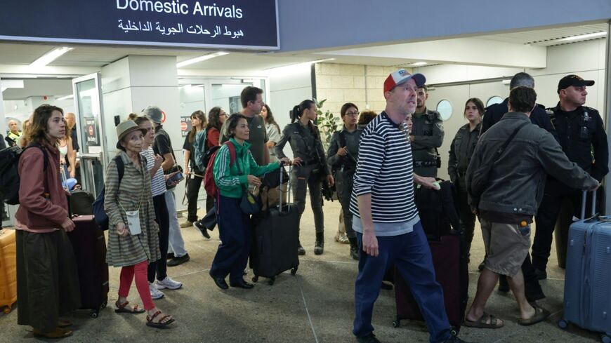 Passengers landed at Israel's Ben Gurion Airport after the their earlier flight was diverted to Saudi Arabia following what Prime Minister Benjamin Netanyahu described as an attempt by one of the pilots to crash the plane