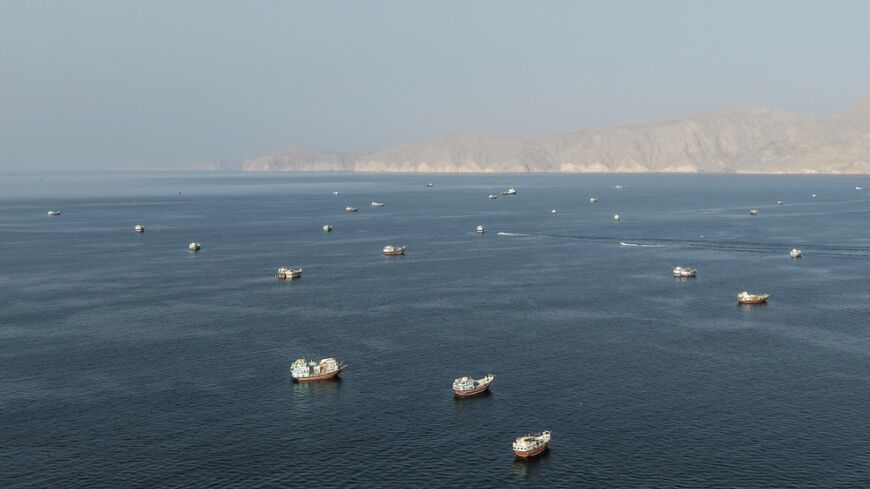 Ships anchored off the coast of Musandam governorate in Oman near the Strait of Hormuz on Friday