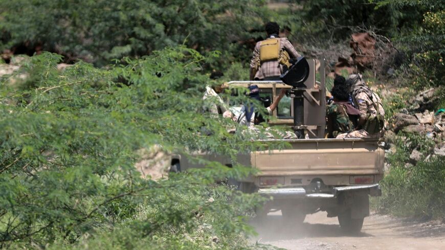 Saudi-backed Yemen government soldiers ride in a pick-up truck near the Jabal Han front, west of the city of Taiz, where battles are ongoing