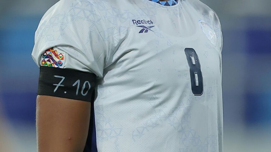 Israel midfielder Dor Peretz wears a black armband with the numbers "7.10" to represent Hamas' October 7, 2023 attack