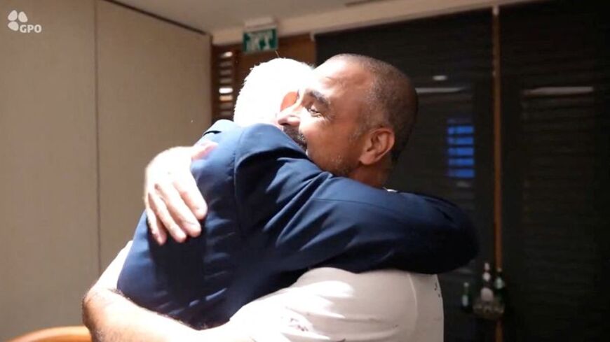 Israeli Prime Minister Benjamin Netanyahu meets Yaniv Hayun, a passenger on the FlyDubai flight