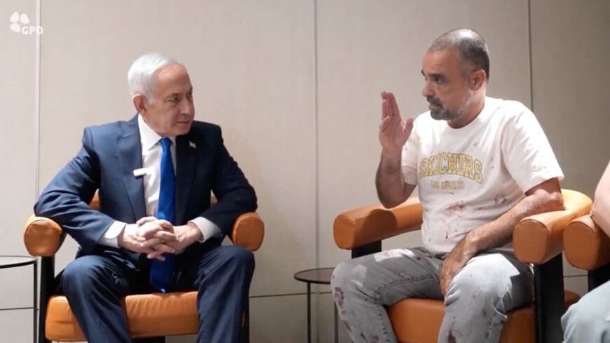 Israeli Prime Minister Benjamin Netanyahu meets Yaniv Hayun, a passenger on the FlyDubai flight