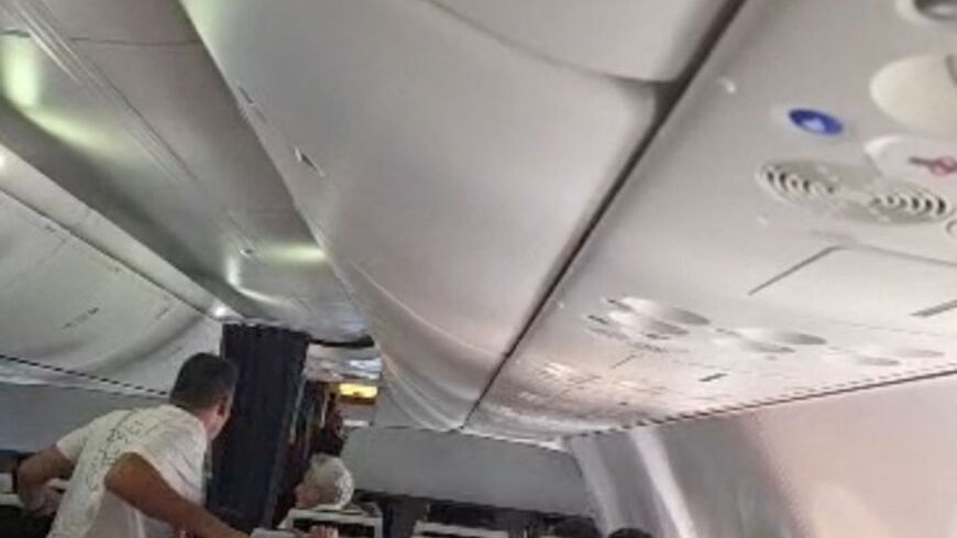 Flydubai passengers react and check after realising there is commotion in the cockpit