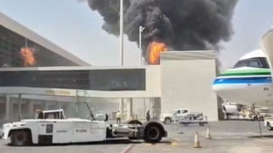 FILE PHOTO: Smoke and flames rise from King Khalid Airport, after Yemen's Iran-backed Houthis said they attacked the airport, in Riyadh