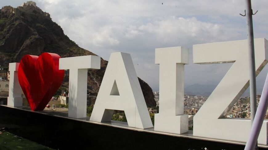 Signage on a mountain overlooking the southwestern city of Taiz,